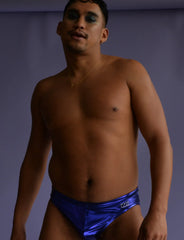Shiny royal blue metallic swim briefs with a small white logo on the left hip for stylish swimming
