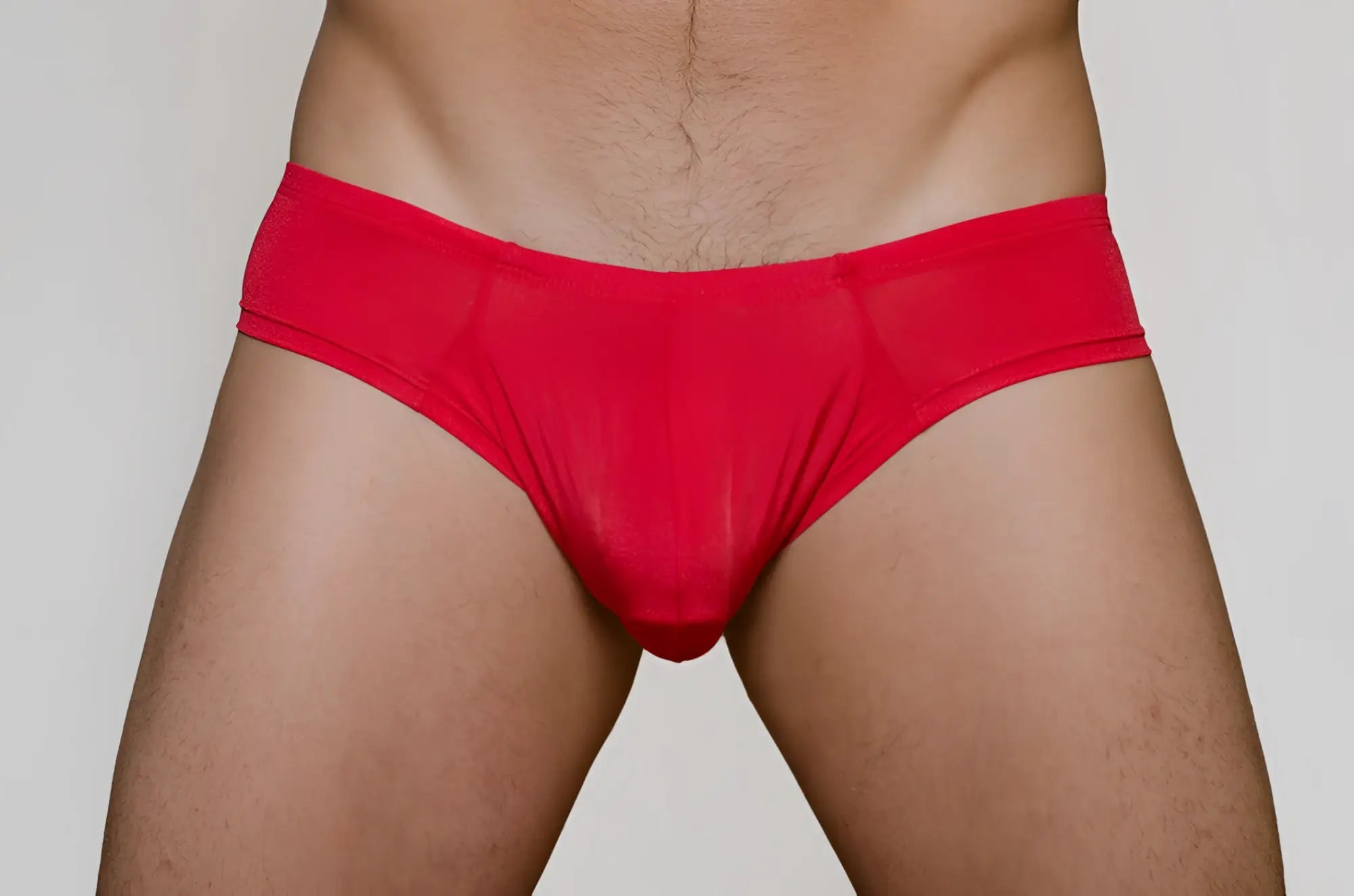 Red form-fitting metro bunz low-rise boxer briefs made of stretchy fabric shown from the back side