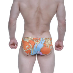 Orange and blue patterned swim trunks with ornate floral design from metro male wear antique bikini 5103-m68