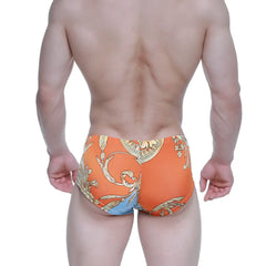 Orange swim trunks with gold and blue ornate baroque pattern by metromalewear antique trunk 2125-65