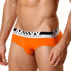 Bright orange MetroMaleWear Asian briefs with a white and black elastic waistband featuring the logo