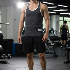 MetroMaleWear basic tank top charcoal gray with white trim and small black logo patch on the lower front
