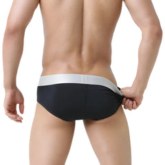 MetroMaleWear Basico Brief black swim trunks with sleek silver waistband designed for comfortable water use