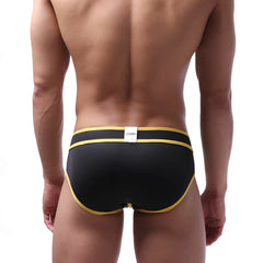 Black briefs with bold yellow trim and white metroMalewear brand tag at waistband swim brief style