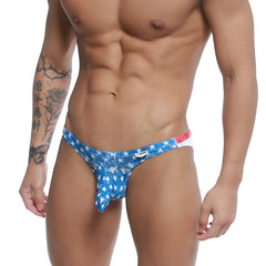 Blue star-patterned men’s swim trunks with red and white waistband MetroMaleWear Cannon Hip Brief Batalla 2203-92