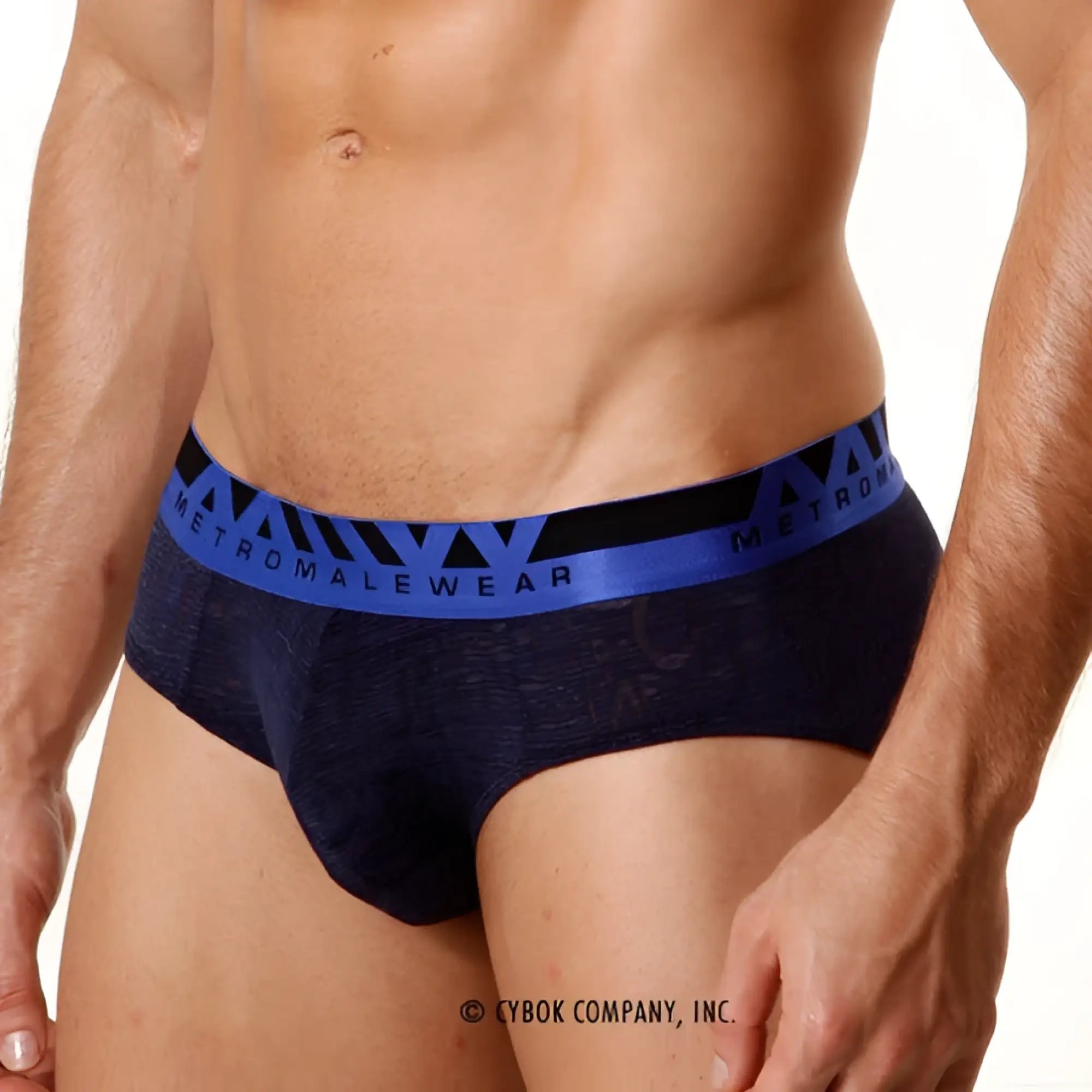 Navy blue textured MetroMaleWear carve hip briefs with bold blue and black elastic waistband and logo detailing