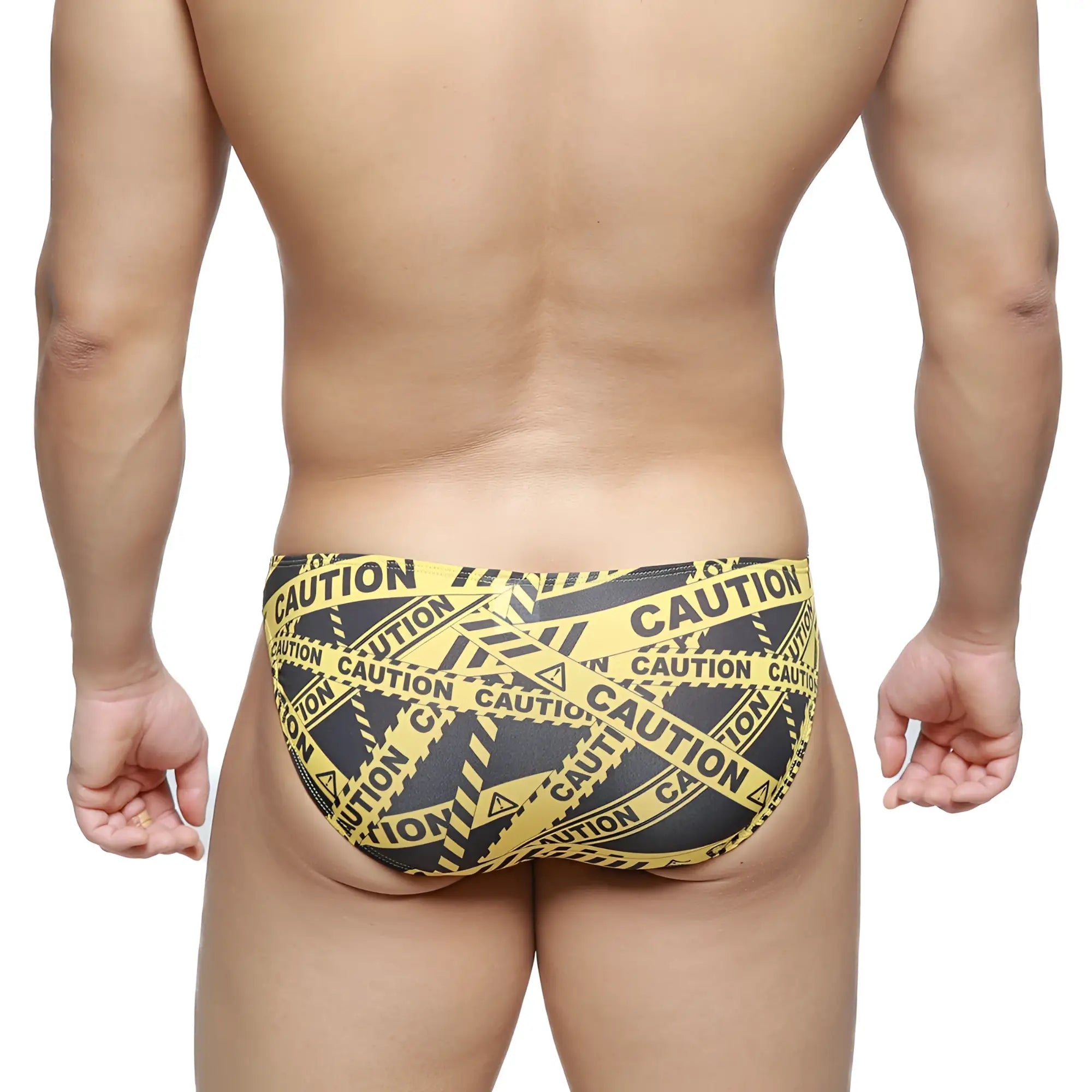 Metro malewear caution lowrise bikini swim trunks in yellow and black caution tape pattern for bold beachwear