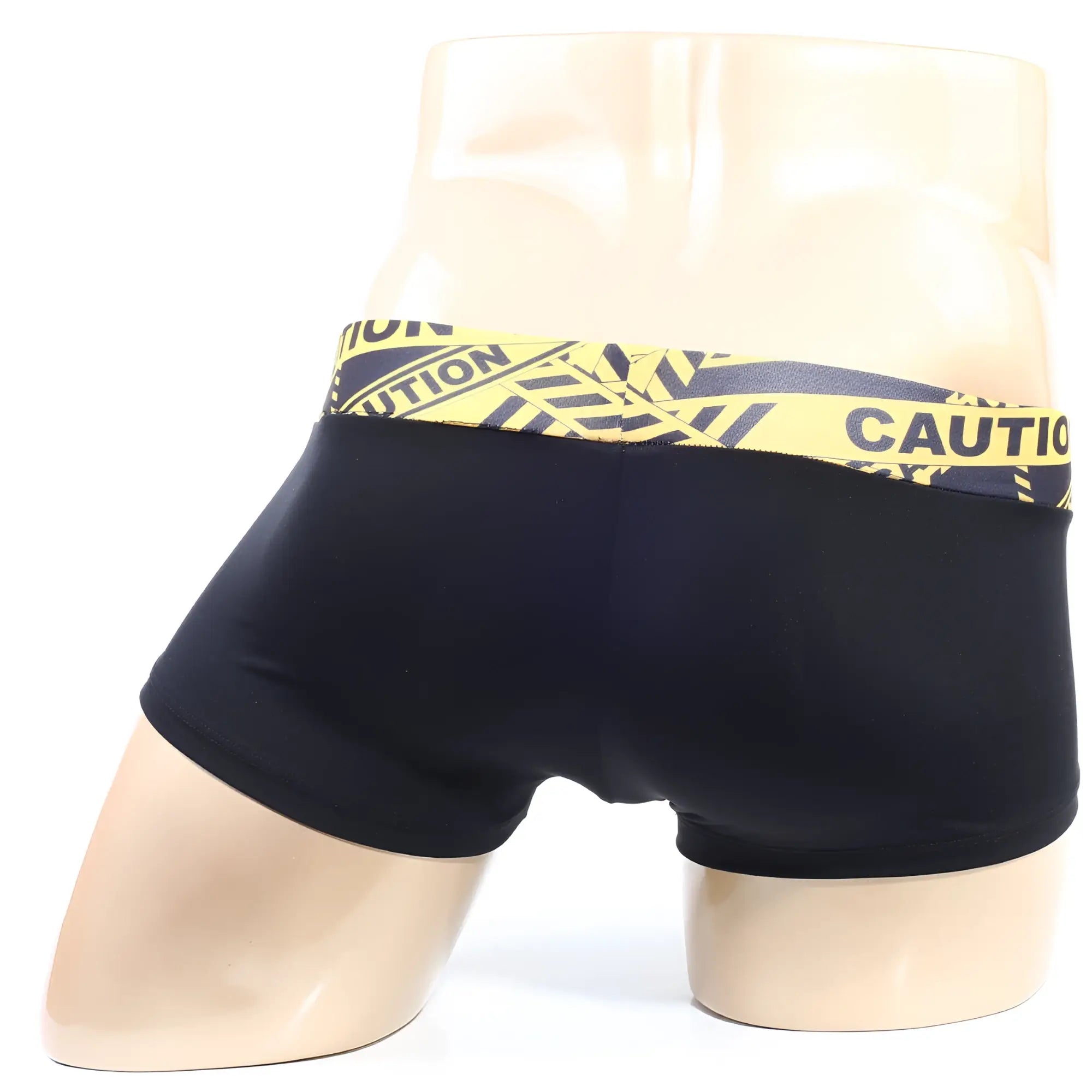Black briefs with a bold yellow and black caution tape patterned waistband by MetroMaleWear model caution short boxer 2026-74