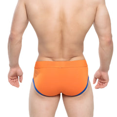 Bright orange metroMalewear ciclerut brief 9004-24 swim trunks with contrasting blue trim on the sides