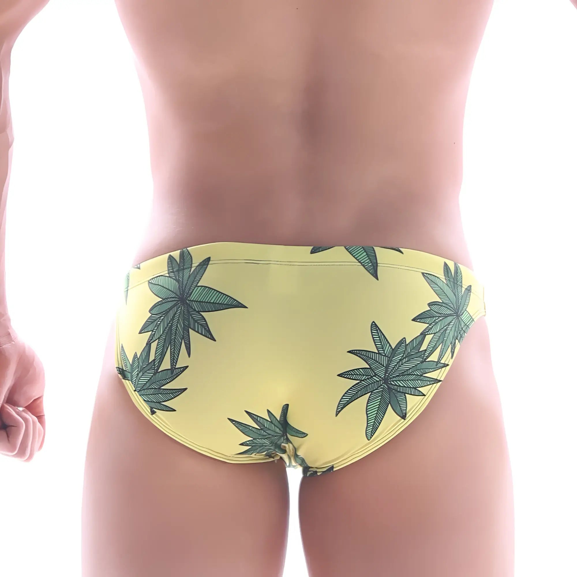 Yellow metro male wear classic swim bikini featuring green cannabis leaf pattern on swim trunks fabric