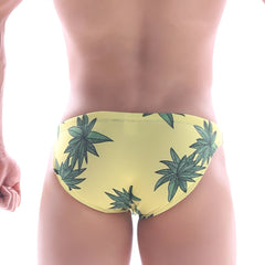 Yellow metro male wear classic swim bikini featuring green cannabis leaf pattern on swim trunks fabric