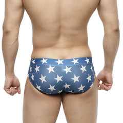 Blue metro-malewear classic swim brief with white star pattern designed for comfortable swimwear use