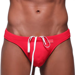 MetroMaleWear classic swim thong red with white drawstrings and small brand tag ideal for beachwear