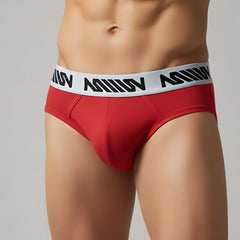 MetroMaleWear Core hip brief in red with a white elastic waistband featuring black stylized lettering