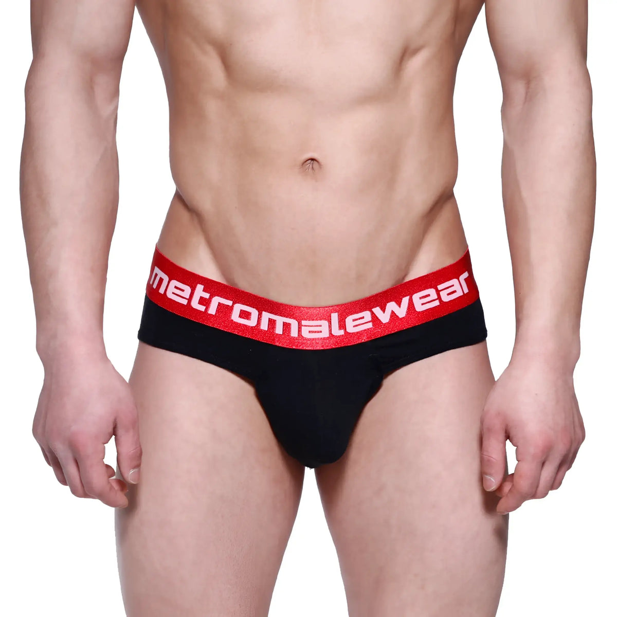 Black briefs with a red elastic waistband featuring the metromalewear logo in white from MetroMaleWear Downhole Brief 3029-20