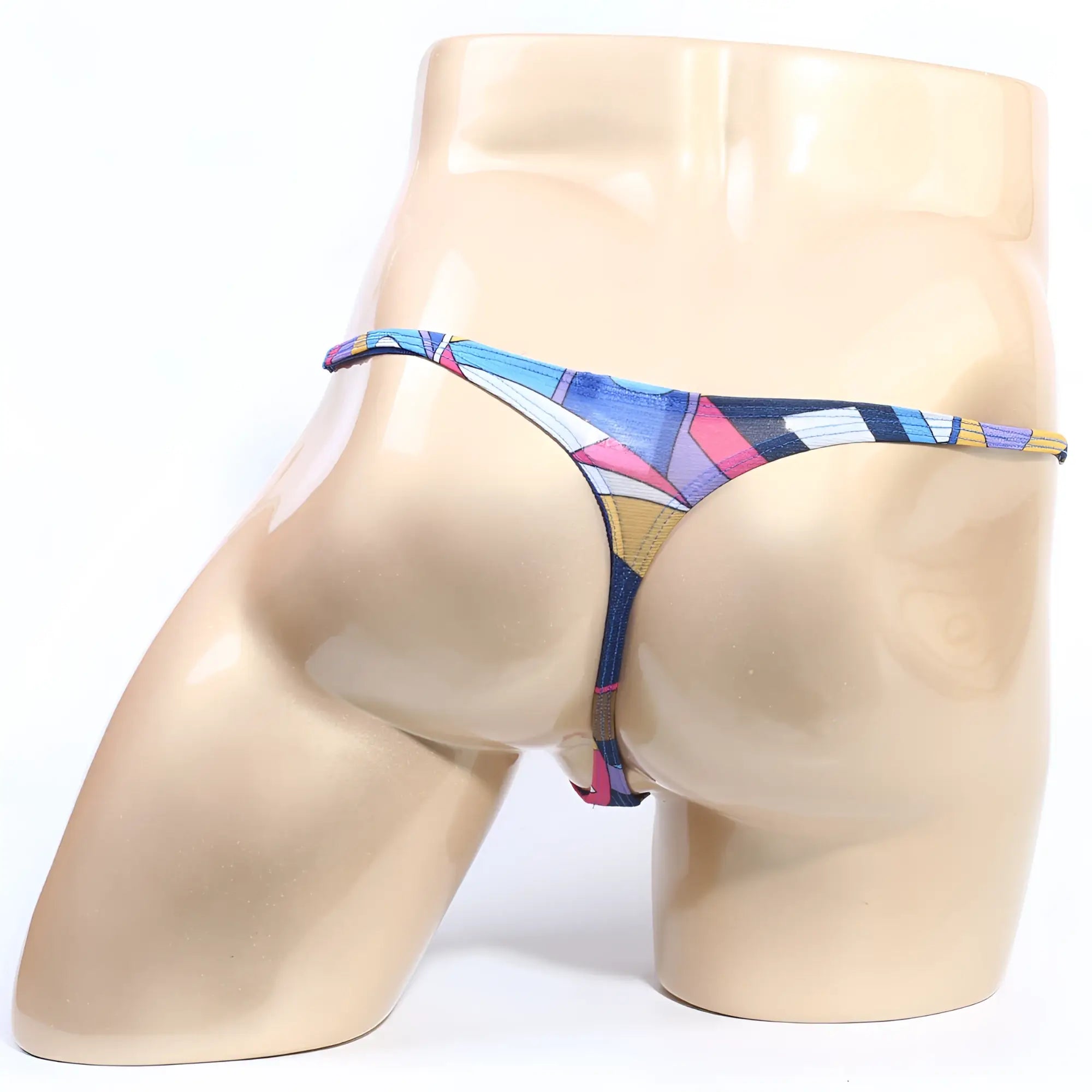A vibrant geometric-patterned thong in blue pink and yellow with thin elastic waistband from MetroMaleWear Fantasy Picasso 6112-87