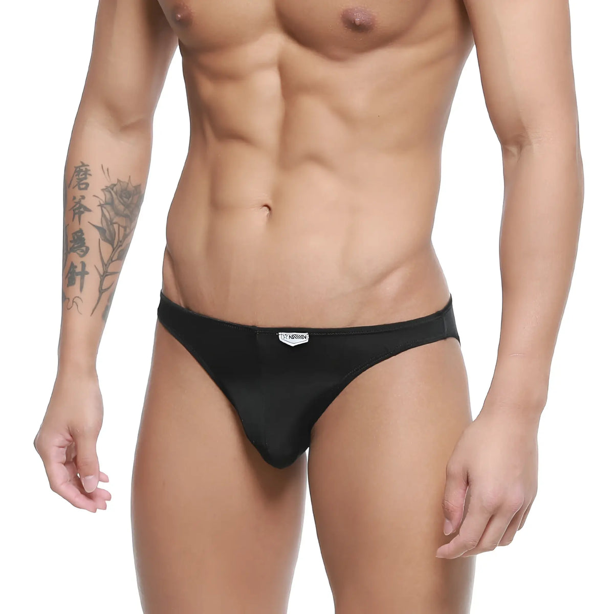 Black sleek form-fitting men’s briefs with subtle brand tag on waistband metroMaleWear fits bikini 6603-20