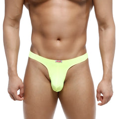 Bright neon green microfiber MetroMaleWear Fria thong with a small red and white brand tag at the waistband