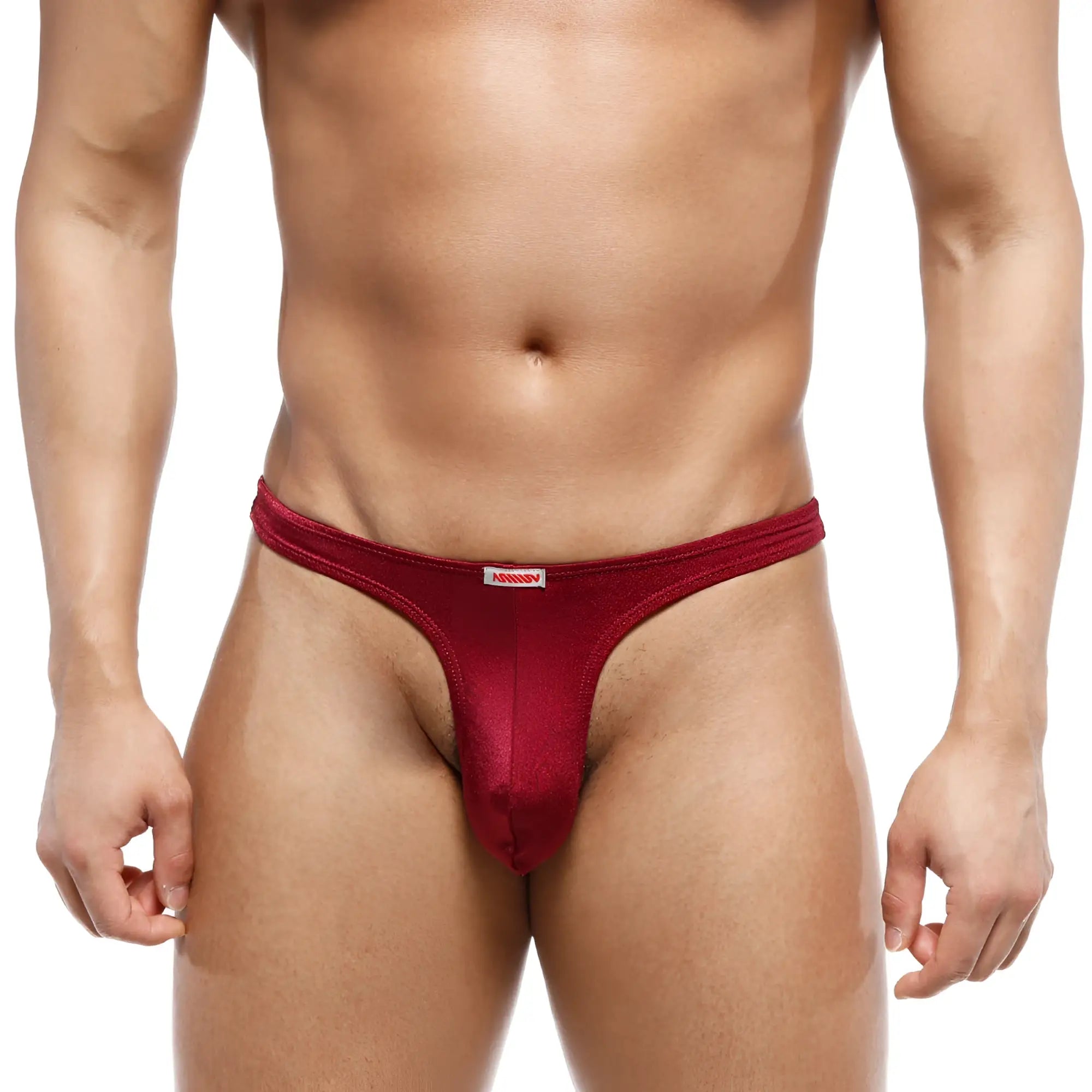A sleek deep red mens thong from MetroMaleWear made of smooth stretchy fabric with a small white brand tag