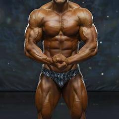 A muscular male bodybuilder wearing metro musclwear basic competition suit with blue and white stripes