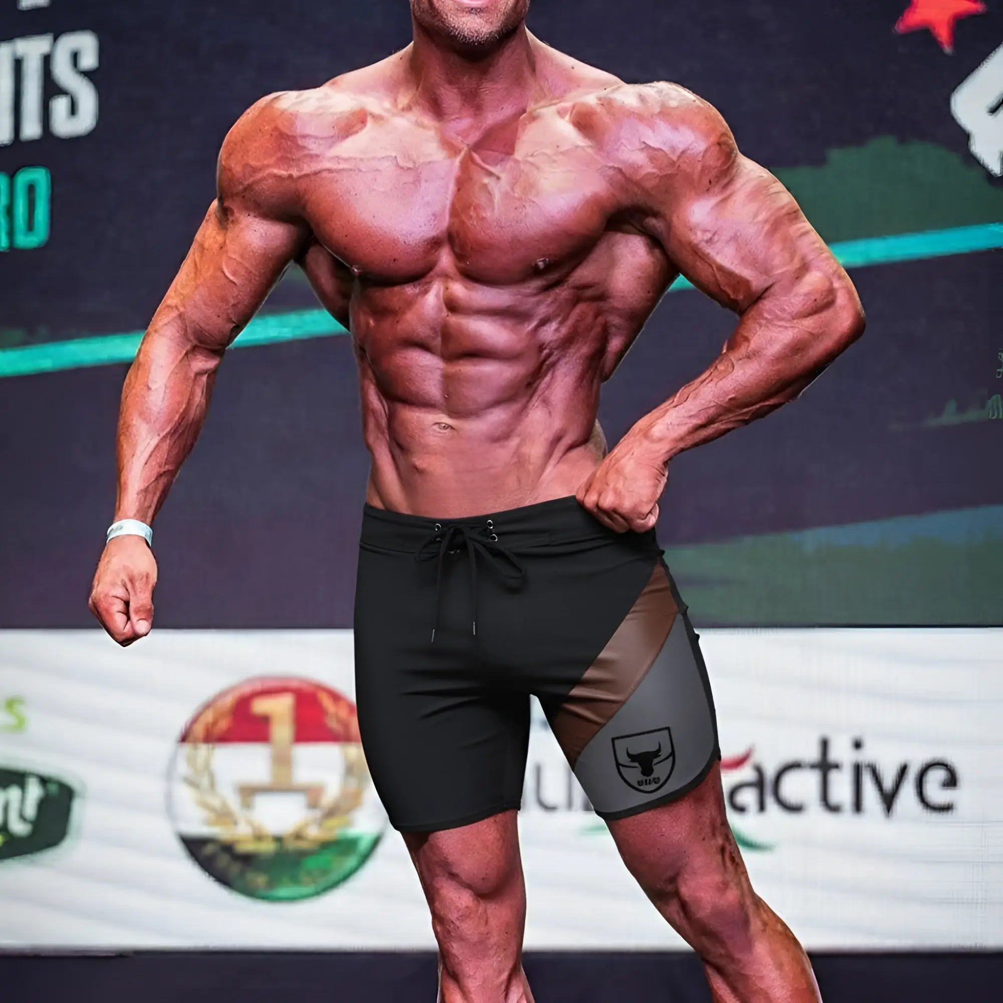 Black and gray MetroMaleWear MetroMuscleWear Cafe Physique board shorts with a bold bull logo on the side