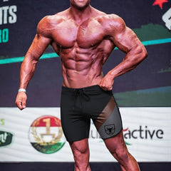 Black and gray MetroMaleWear MetroMuscleWear Cafe Physique board shorts with a bold bull logo on the side