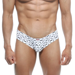 White men’s swim trunks with bold black geometric mustache pattern and arrow brand name from MetroMaleWear Micro Cheek Caballero 2027-03
