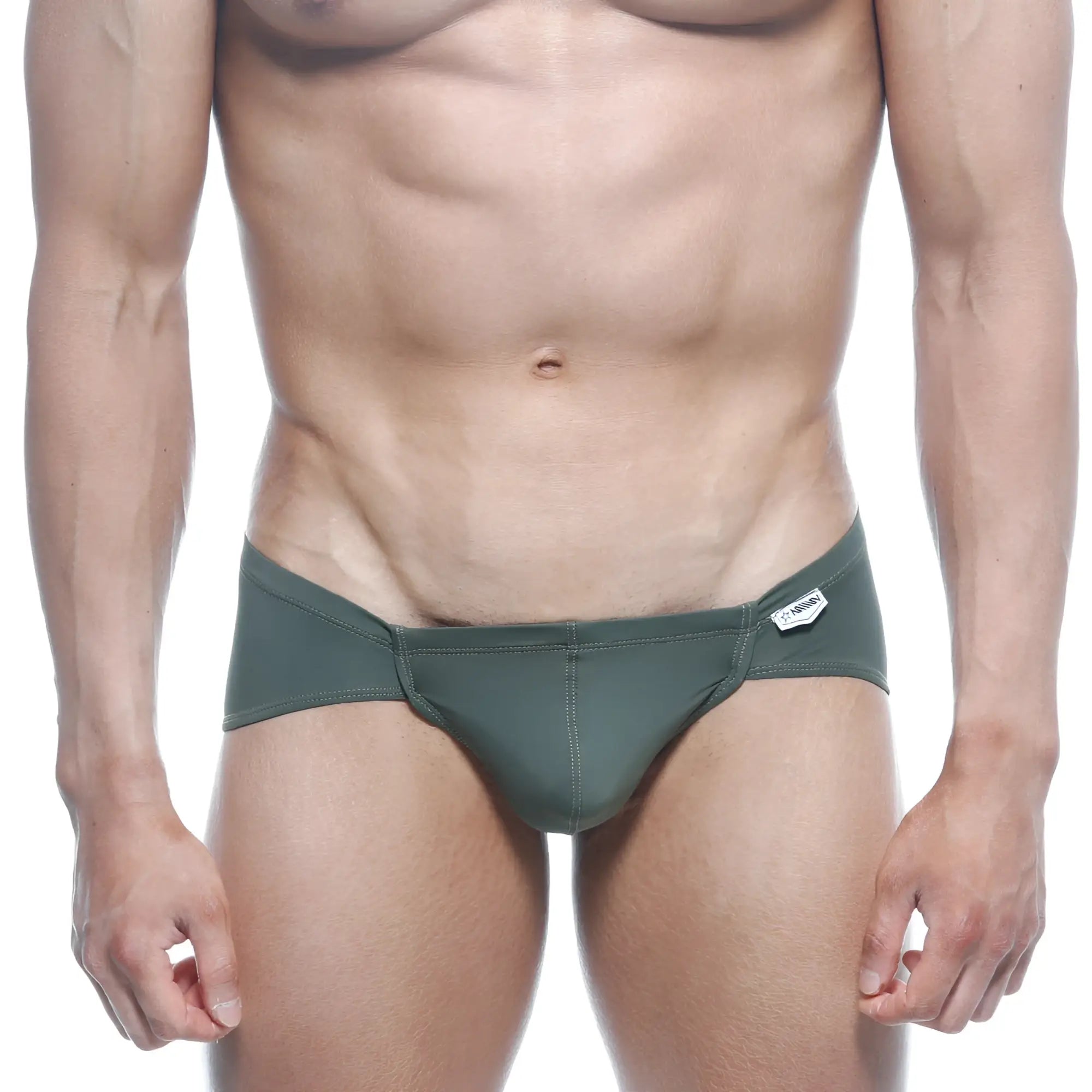 Dark green form-fitting swim trunks with sleek modern design and small white metro male wear brand tag on waistband