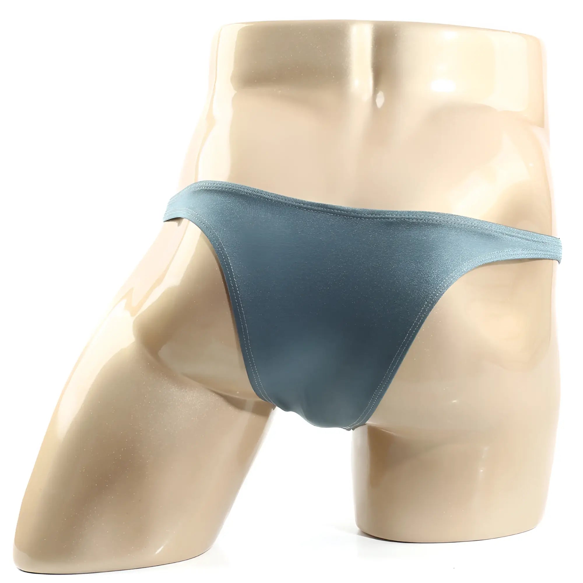 A sleek matte teal bikini thong made of smooth fabric with a minimalist design from MetroMaleWear Monaco