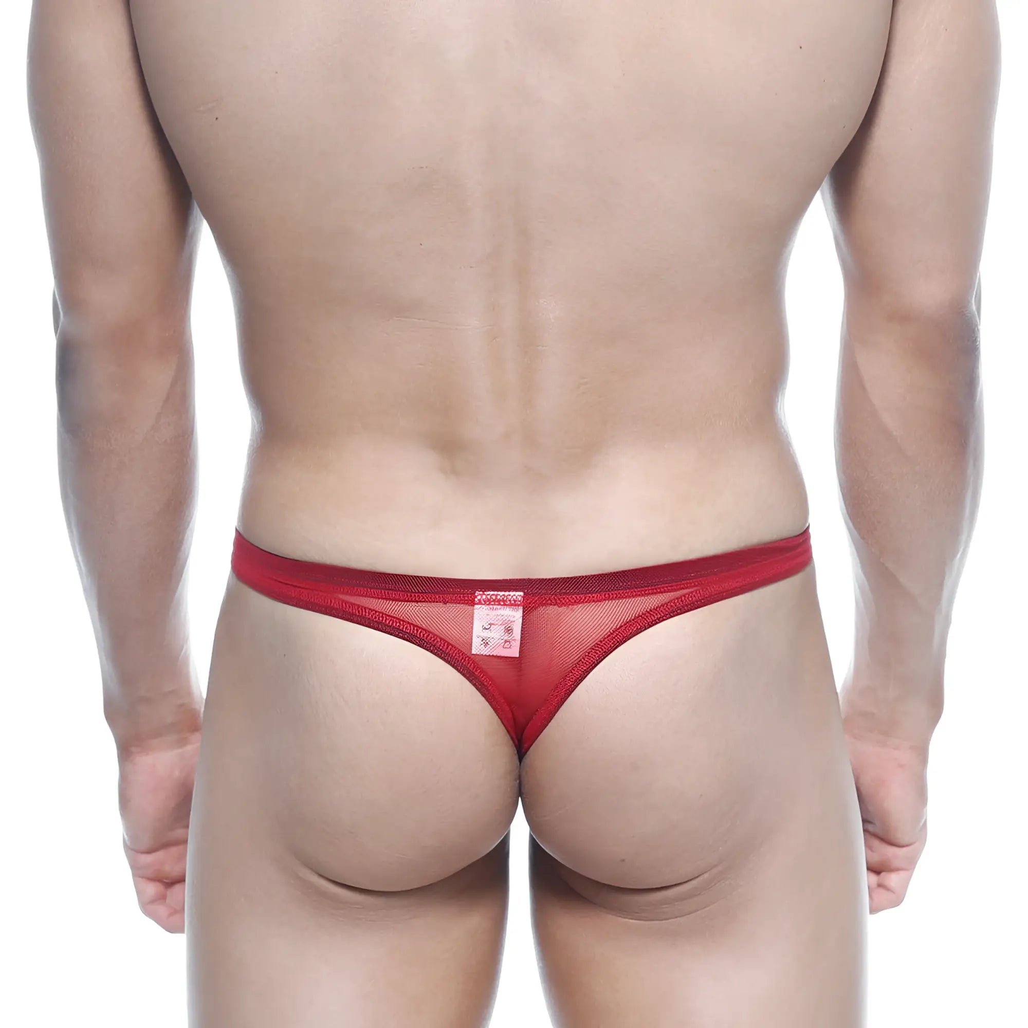 Red mesh thong back view with a small rectangular label by metromalewear in bright red net fabric