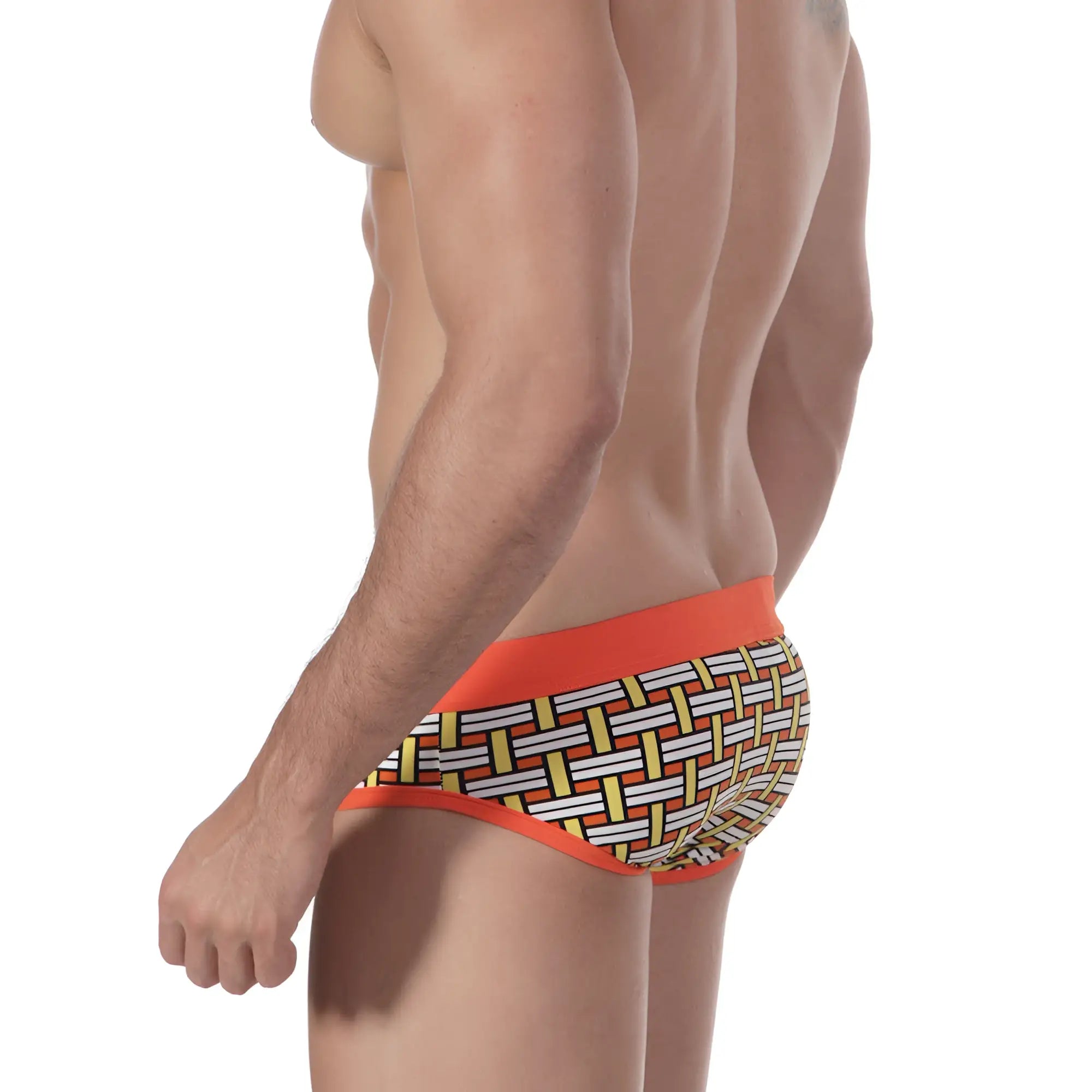 Metro male wear orange colander swim brief with orange trim and geometric basketweave pattern in white yellow and black
