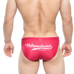 Bright pink men’s swim bikini surf trunks with a white metromalewear original logo and three stars design