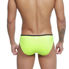 Bright neon green swim trunks with black waistband from MetroMaleWear Over-Limit Bikini 2206-07 front view