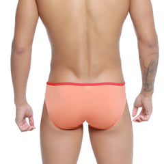 MetroMaleWear over-limit bikini briefs in coral with a red elastic waistband perfect for comfortable everyday wear