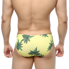 Yellow metroMalewear Palmera Bikini 5103-37 swim trunks with bold green cannabis leaf pattern for beachwear