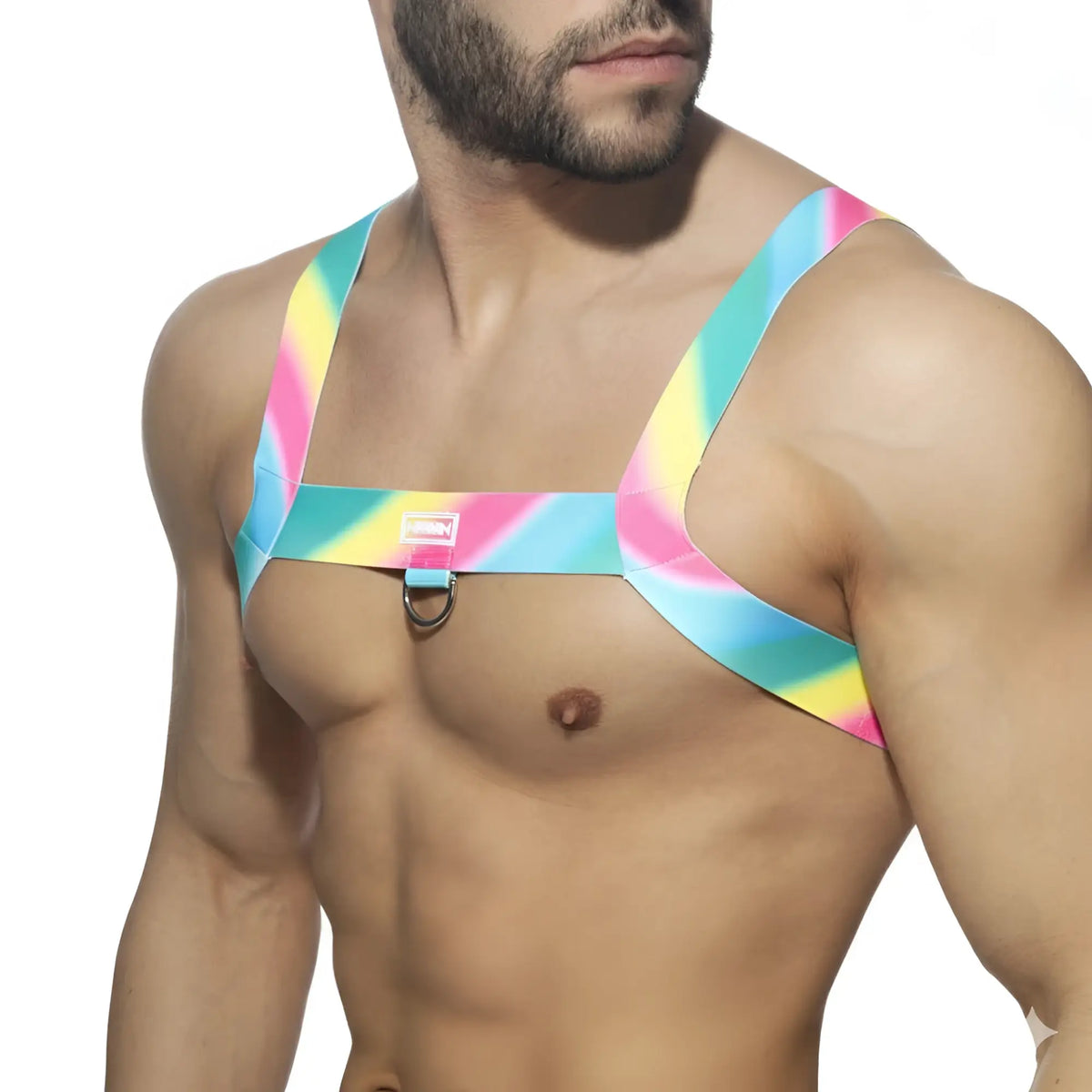 A vibrant rainbow-striped pastel harness by MetroMaleWear with central metal ring and adjustable straps