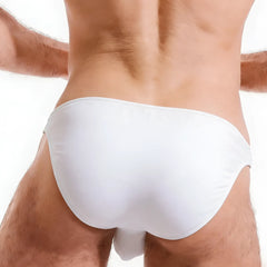 White smooth-textured cotton bikini swim trunks with sleek minimalist design by metroMalewear perfect scene