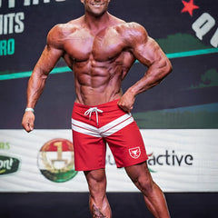 Red athletic shorts with white stripes and small bull logo on left leg from metromalewear physique board short crimson 4706-13