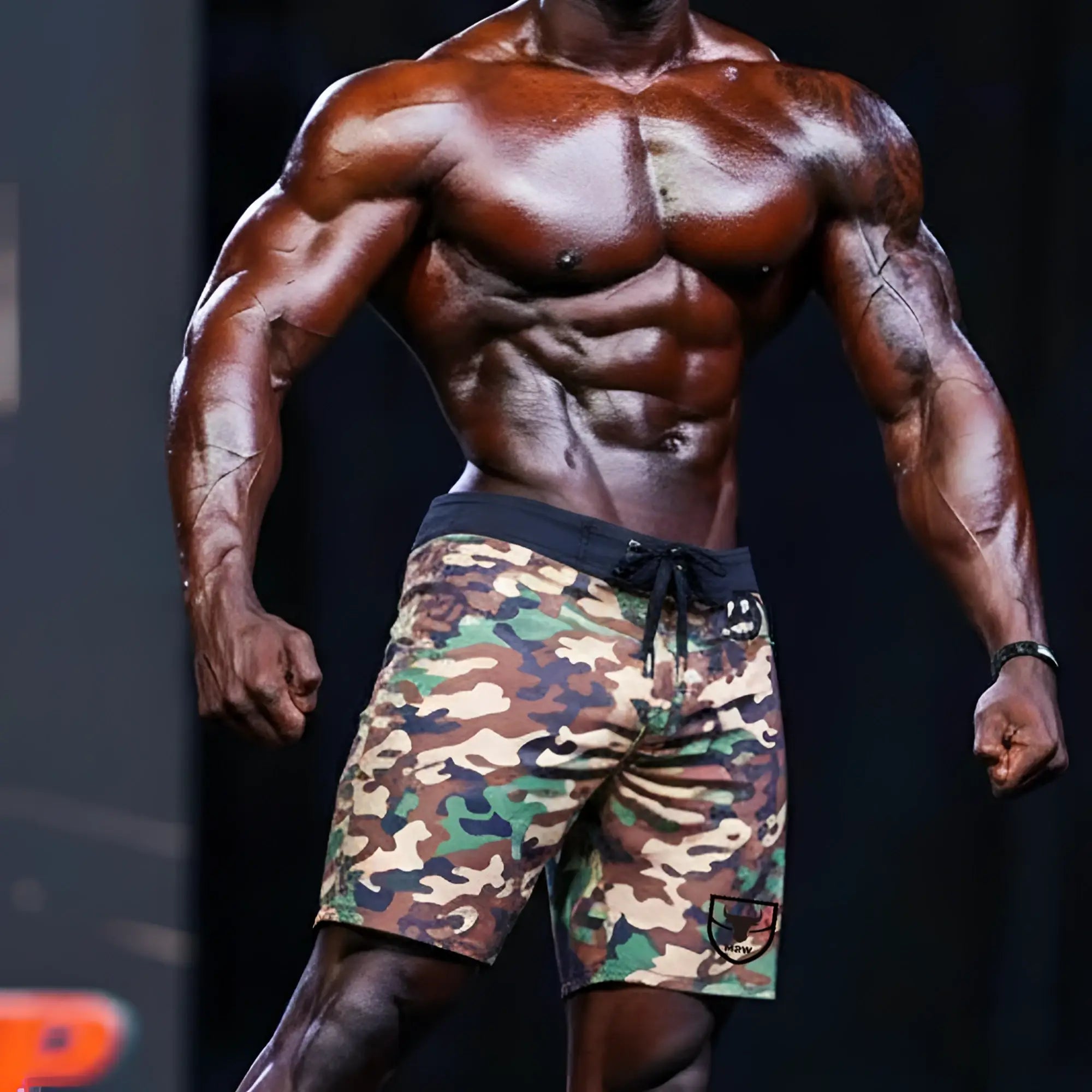 Metro malewear physique board short green camo with black drawstring waistband and logo patch on lower right leg