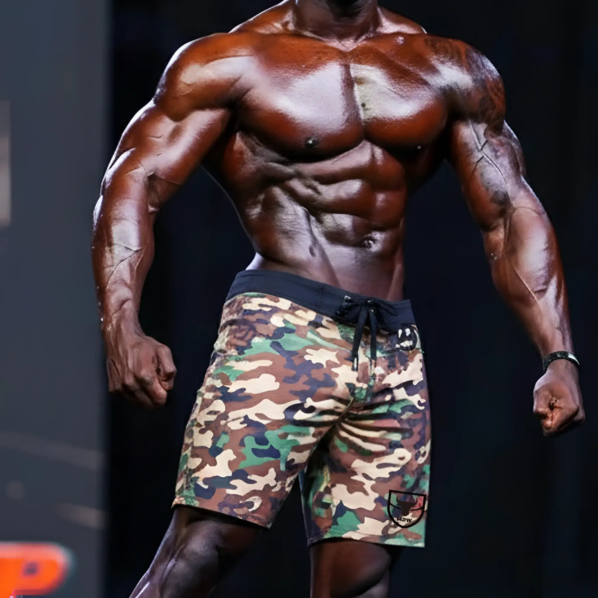 Metro malewear physique board short green camo with black drawstring waistband and logo patch on lower right leg