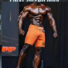 MetroMaleWear physique board short in neon orange with white drawstring and black logo patch for athletic use