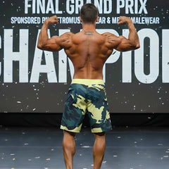 MetroMaleWear physique board short in yellow camo with a yellow waistband featuring a camouflage pattern