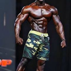 MetroMaleWear physique board short yellow camo with green and yellow camouflage, white drawstring, and side black patch