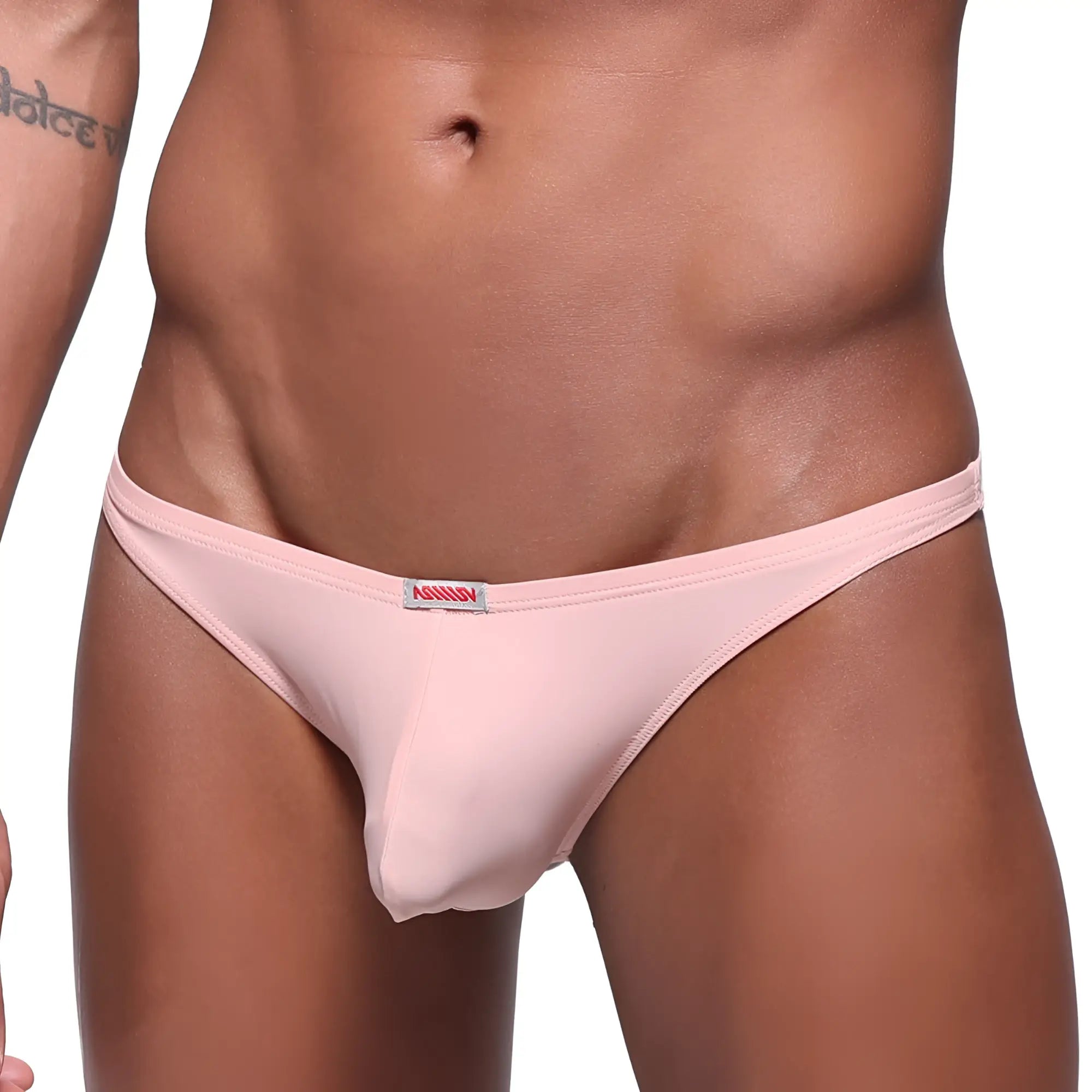 Pink metroMaleWear pouch thong made of soft fabric with small red and white brand tag at waistband