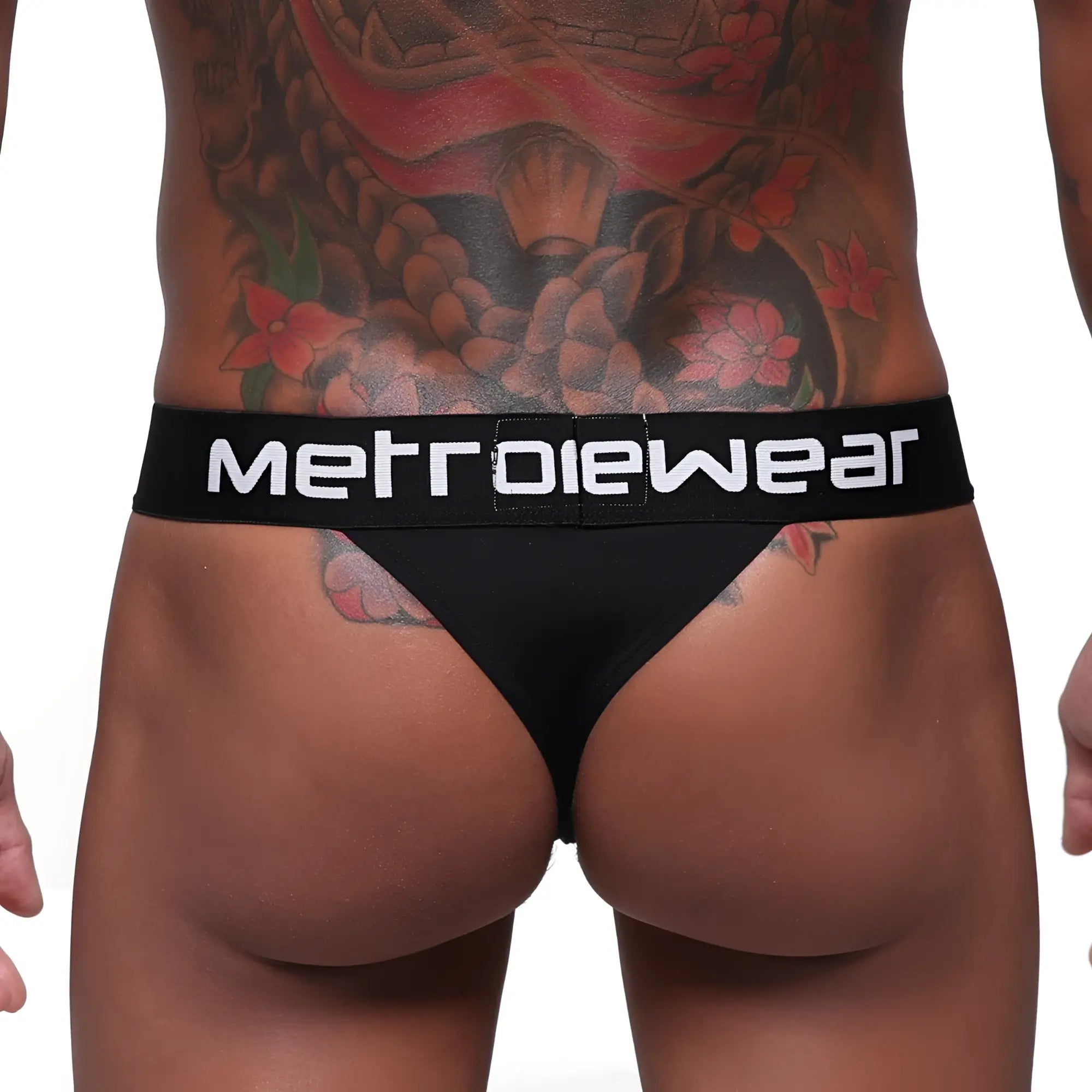 Black MetroMaleWear Prieto thong with white logo band made of metrowear fabric shown from the back side