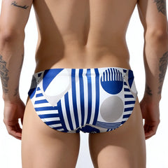 MetroMaleWear Proyecto Bikini 5103-M86 swim trunks in blue and white with bold geometric stripes circles and abstract shapes