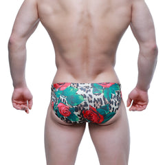 MetroMaleWear Rosee Bikini 5103-M81 swim trunks with vibrant red roses and green leaves on bold leopard print