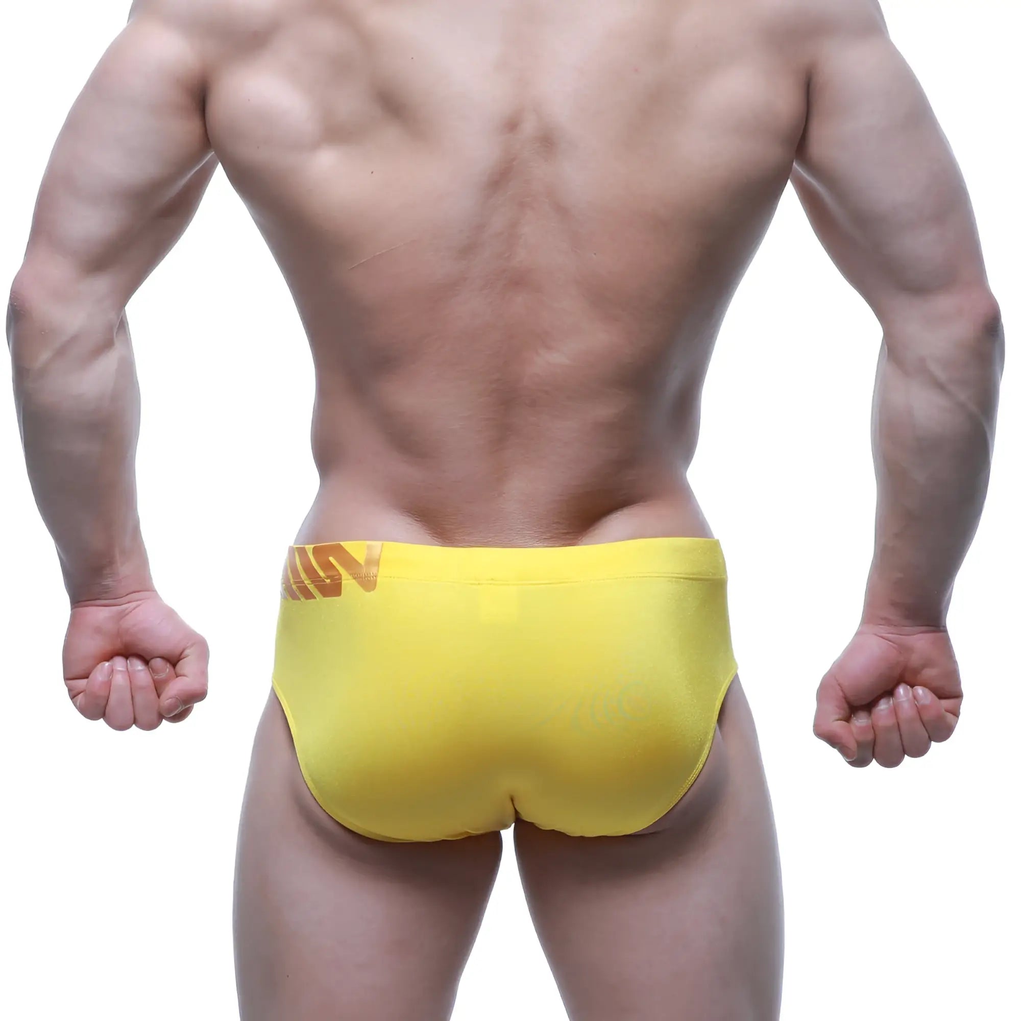 Bright yellow MetroMaleWear Rubio swim brief with subtle orange logo on waistband in athletic stretch fabric