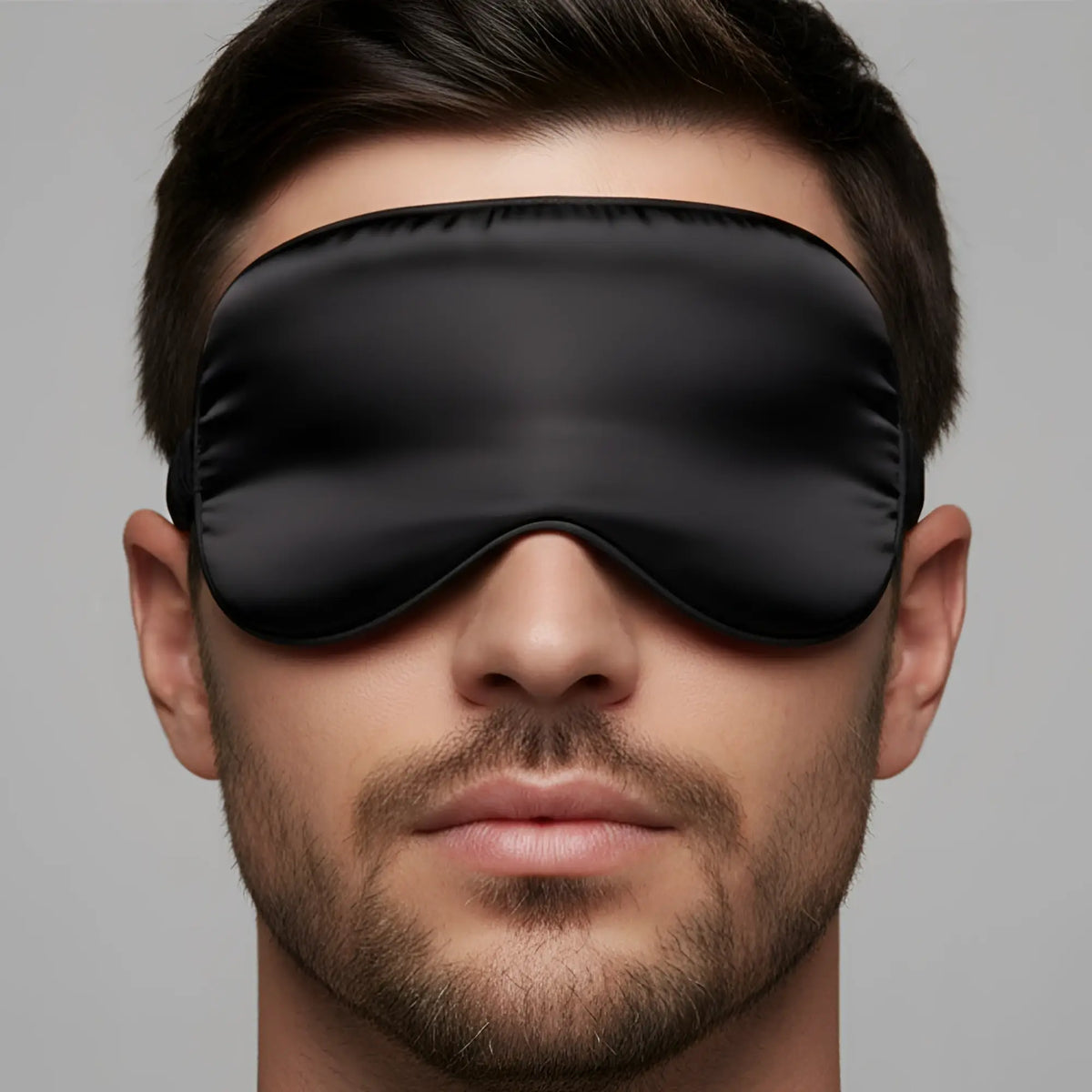 Black satin sleep mask with smooth glossy finish and elasticized edges by MetroMaleWear silky eye mask