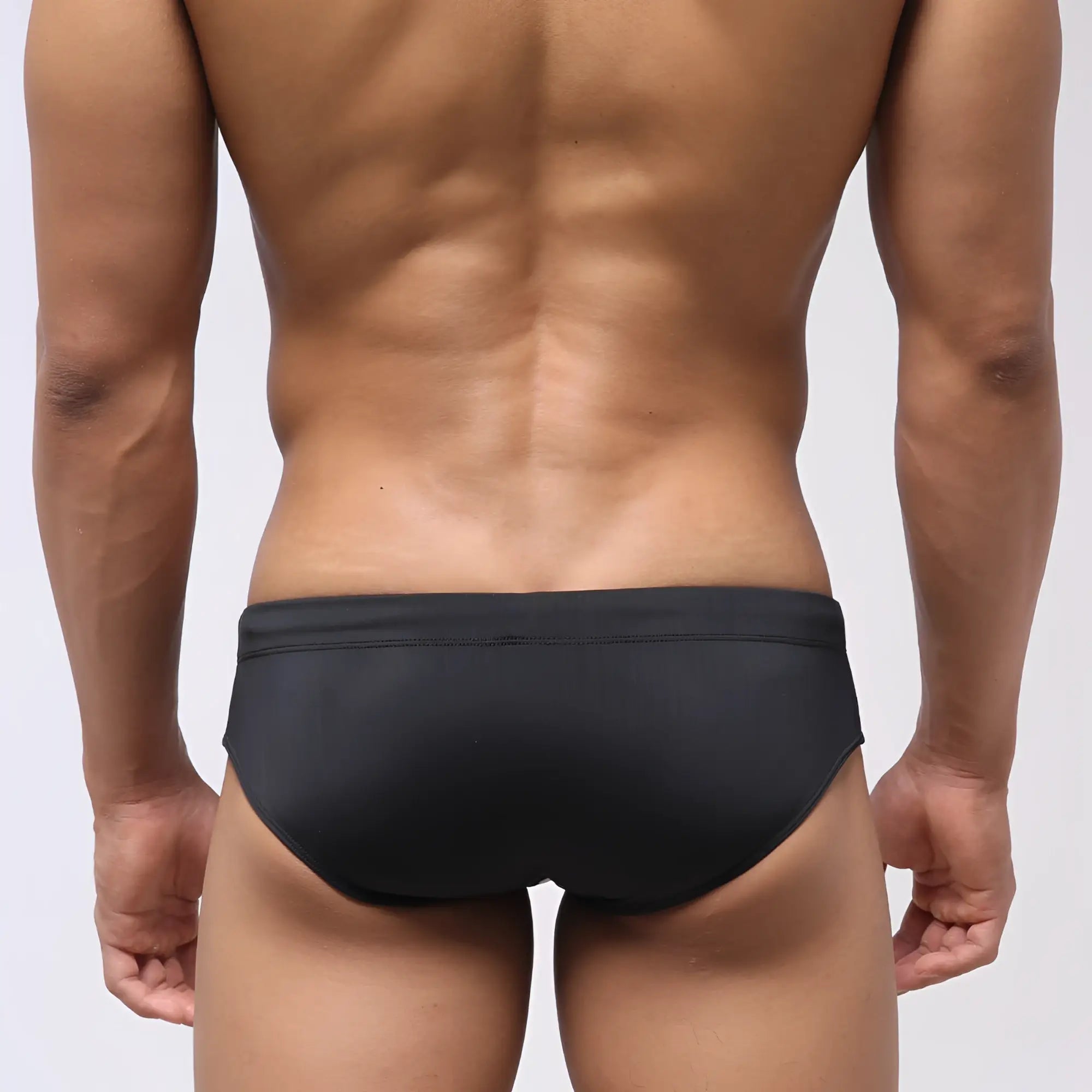 Black metroMalewear stripe swim bikini with smooth form-fitting design for comfortable swimming and beachwear